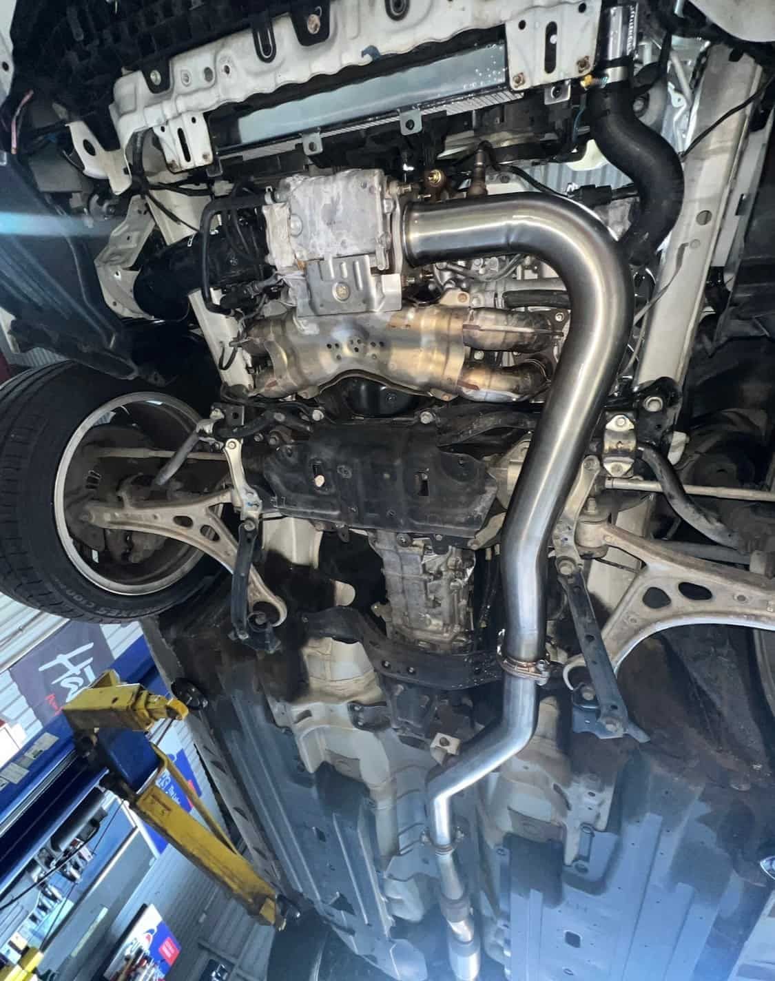 The Underside of a Car With a Exhaust Pipe Attached to It — AWS Mechanical in Stuart Park, NT