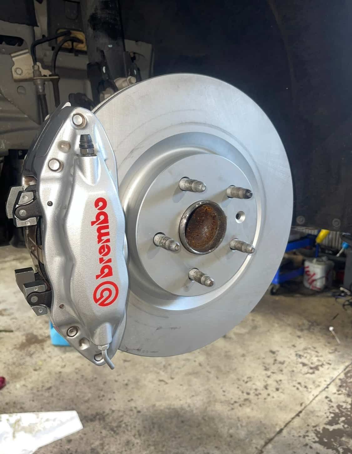 A Close Up of a Brembo Brake Caliper on a Car — AWS Mechanical in Stuart Park, NT