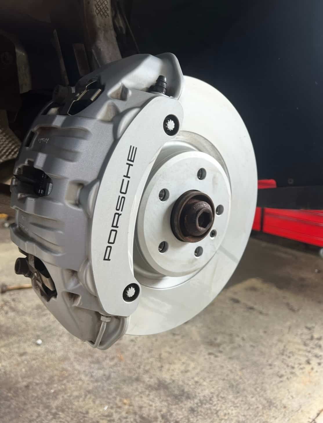 A Close Up of a Porsche Brake Disc on a Car  — AWS Mechanical in Stuart Park, NT