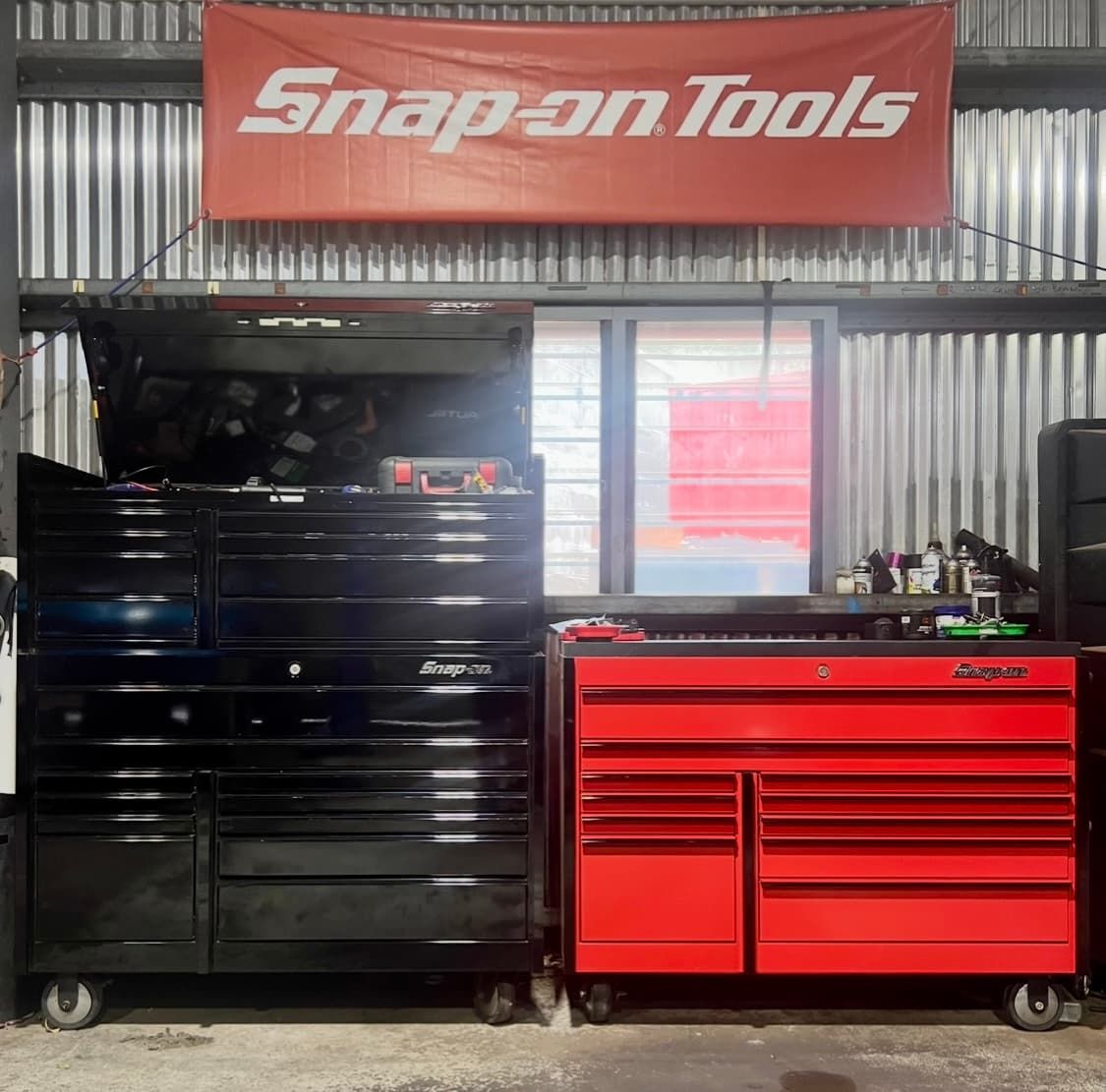 A Snap on Tools Sign Hangs Above a Black Toolbox and a Red Toolbox  — AWS Mechanical in Stuart Park, NT