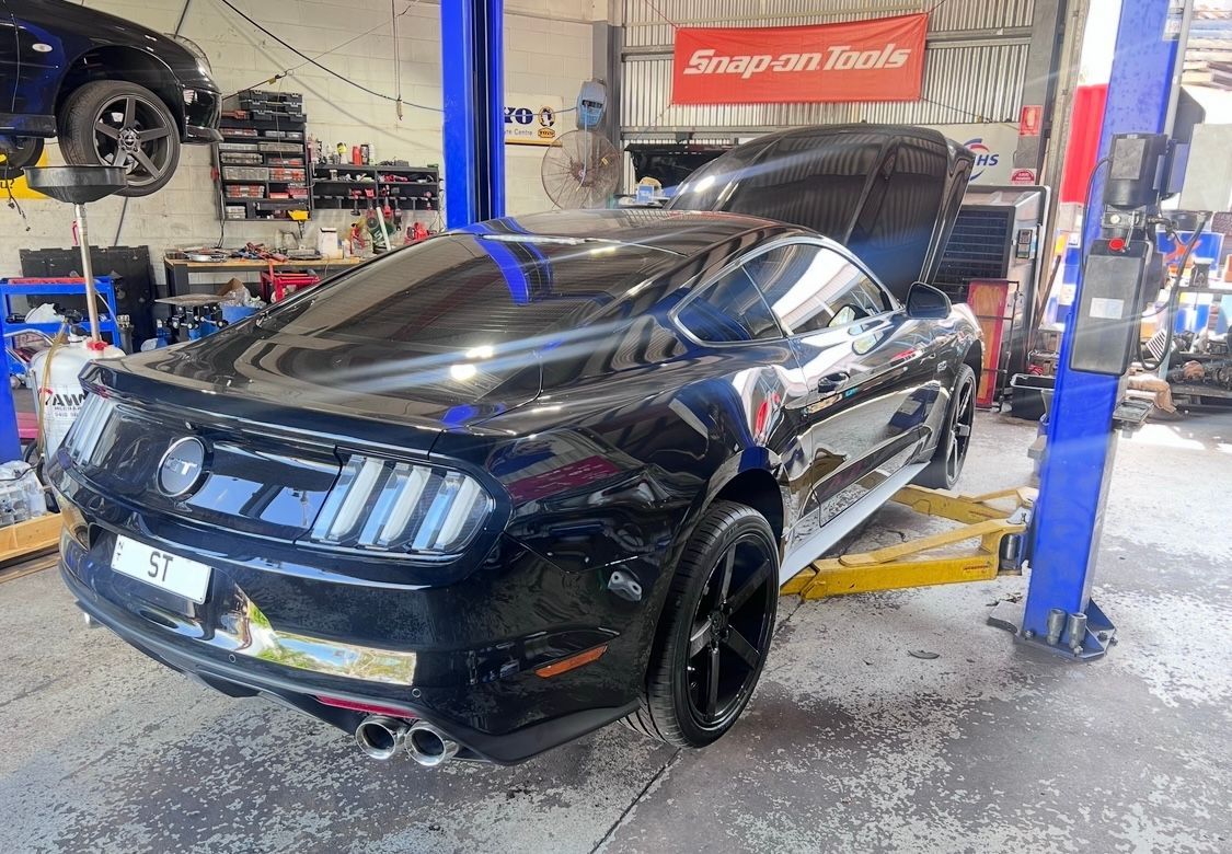 A Black Car Parked at a Mechanic — AWS Mechanical in Stuart Park, NT