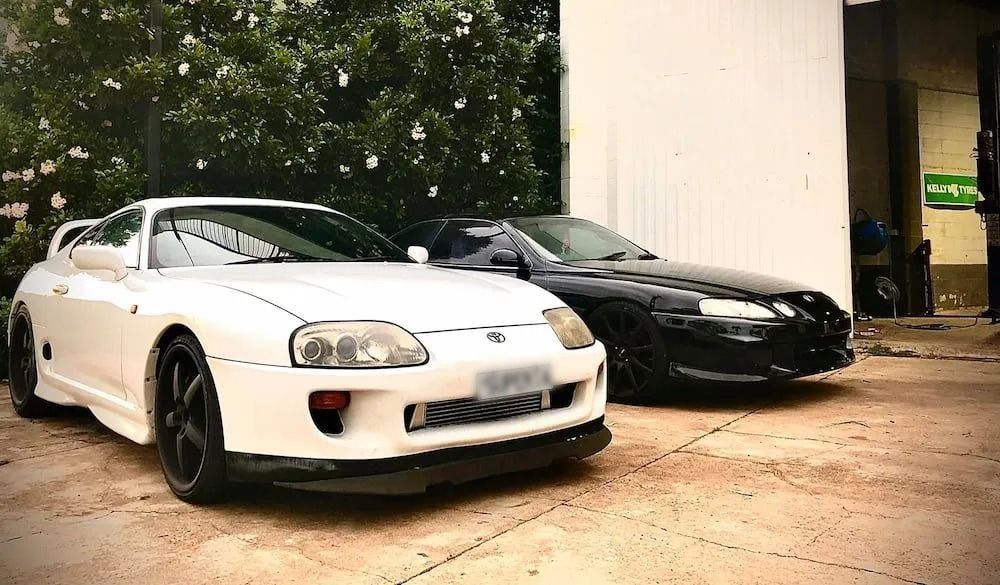 Two Sports Cars Are Parked Next to Each Other in a Parking Lot — AWS Mechanical in Stuart Park, NT
