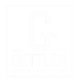 white logo that says gettler construction