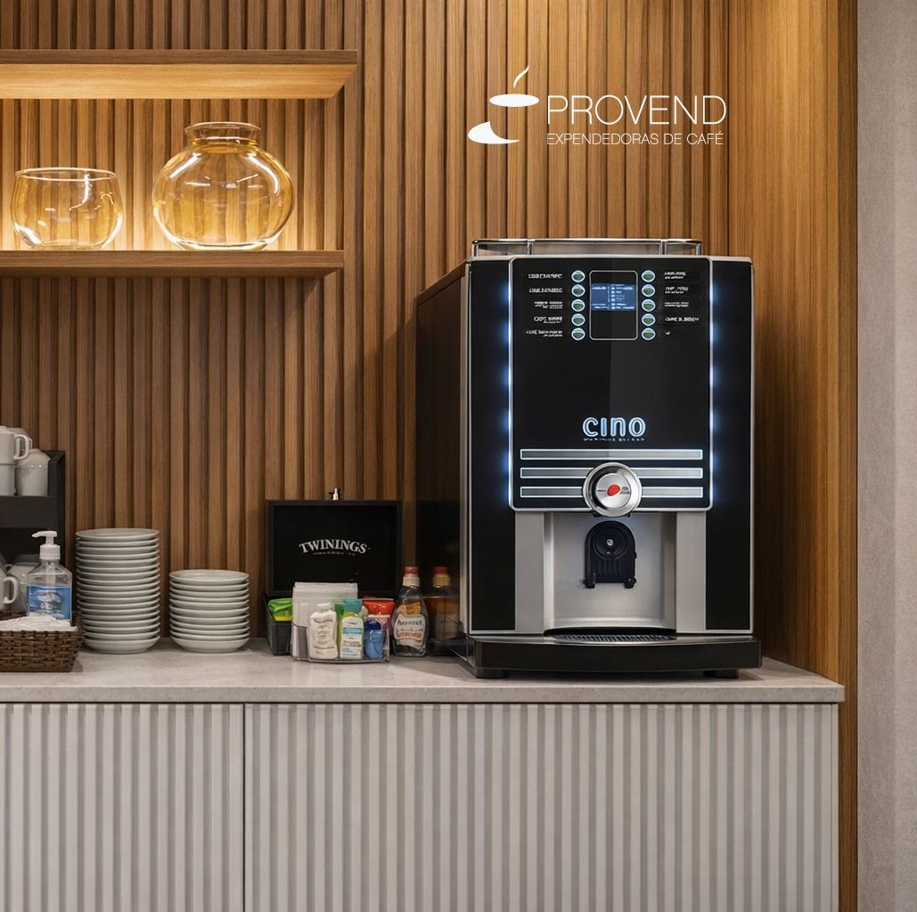 Cafetera de color negro con detalles en rojo, pico dispensador y botones de selección de producto.