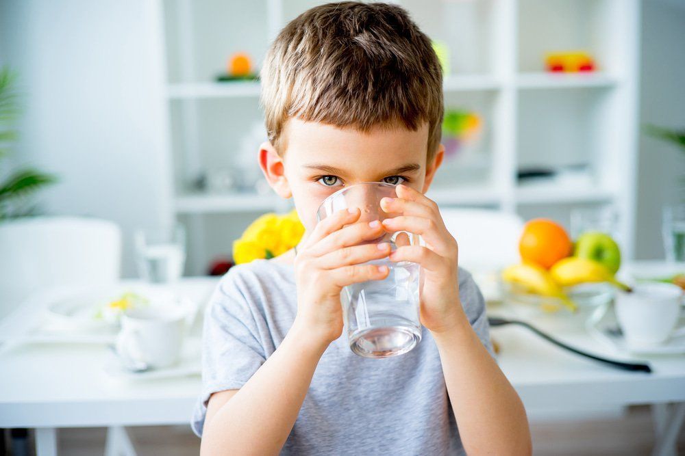 Boy Drinks Water From a Glass — Port Macquarie Pure Water In Port Macquarie, NSW
