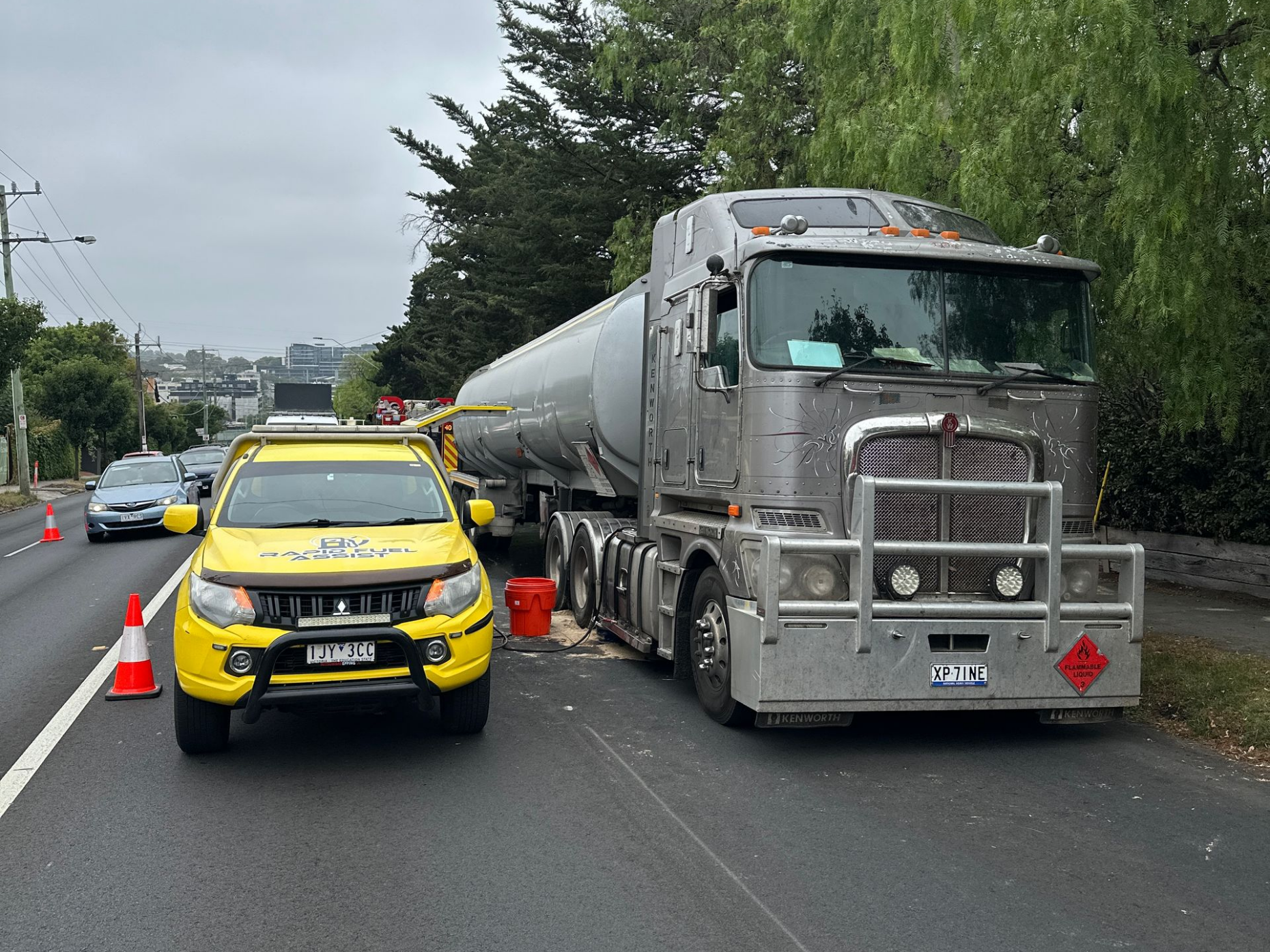 Rapid Fuel Assist collecting diesel fuel spill waste from truck incident in Malvern Melbourne after emergency services response