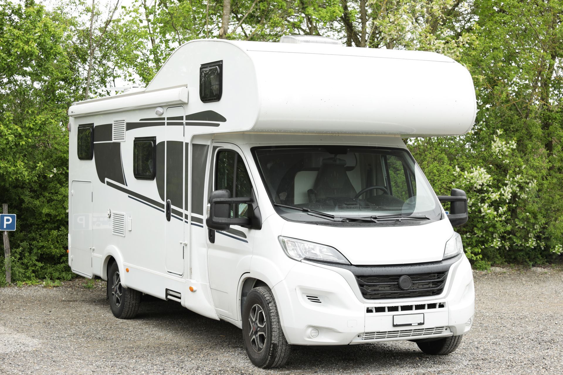 White motorhome parked on gravel. — Bay & Basin Storage In Nowra, NSW