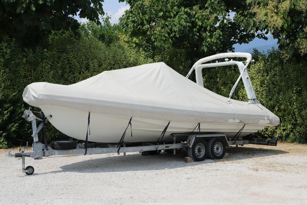 White Boat on a Trailer, Covered With a White Tarp — Bay & Basin Storage In Nowra, NSW