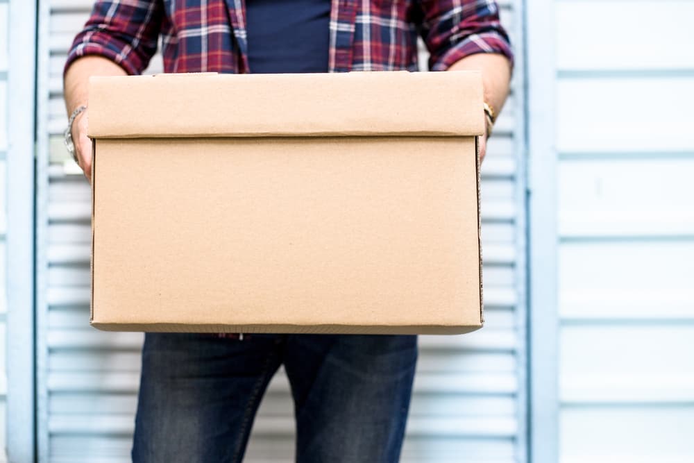 Man Holding Box — Bay & Basin Storage In St Georges Basin, NSW