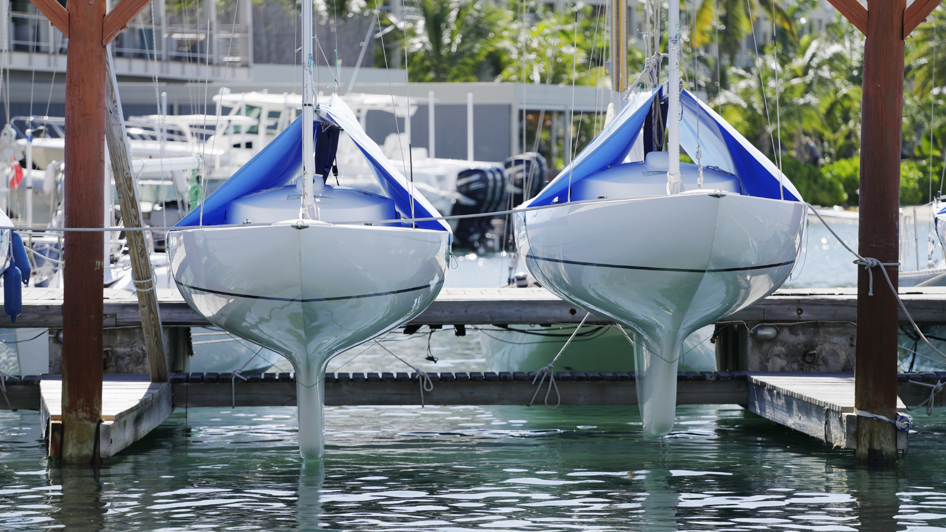 A boat is being towed by a trailer in the water