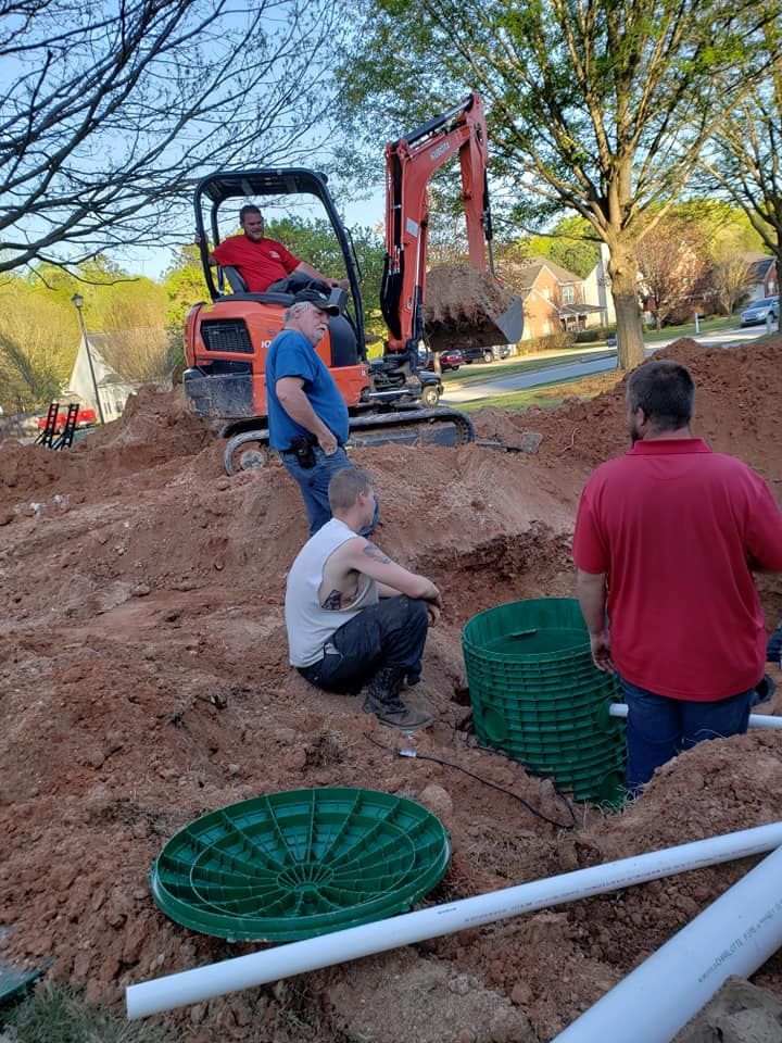 Workers Installing a New Septic Tank — Monroe, GA — Right Price Plumbing and Septic