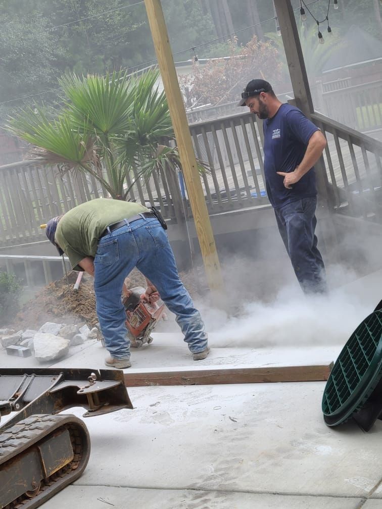 Two Men Working on Backyard — Monroe, GA — Right Price Plumbing and Septic