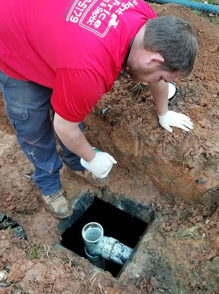 Worker Checking the Pipe — Monroe, GA — Right Price Plumbing and Septic