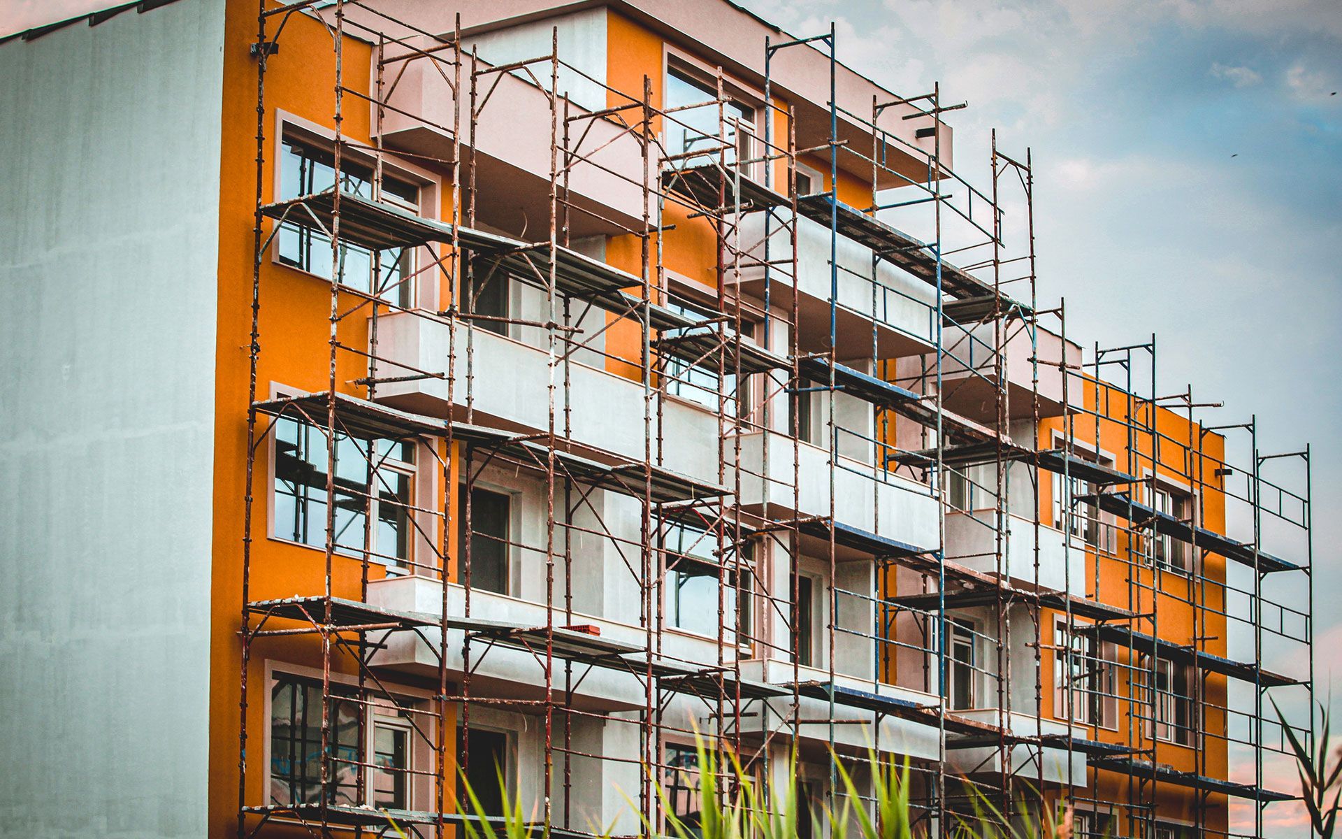 A building under construction with scaffolding around it.