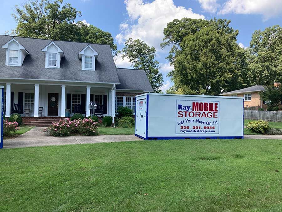 Remodeling Storage: A house with a mobile storage box in front of it