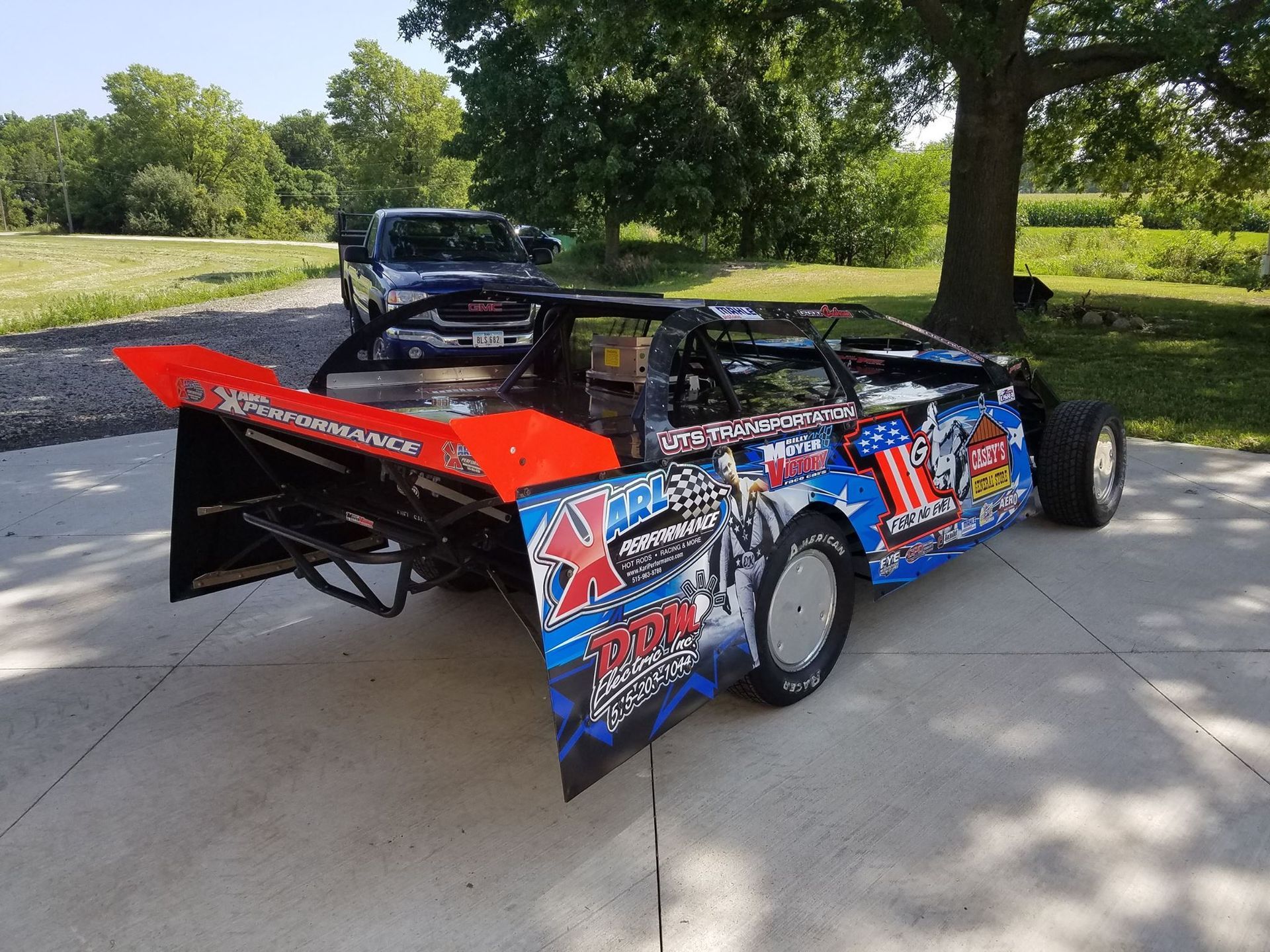 A race car is parked on the side of the road