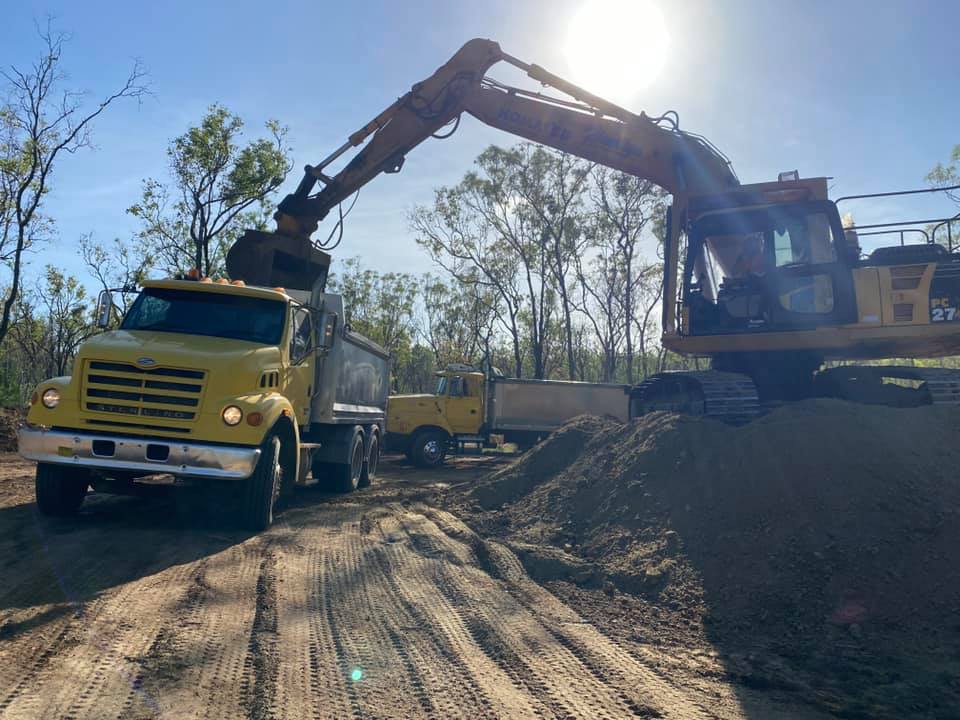 Tipping Truck Unloaded Rocks — Huntlys Heavy Equipment in Gracemere, QLD