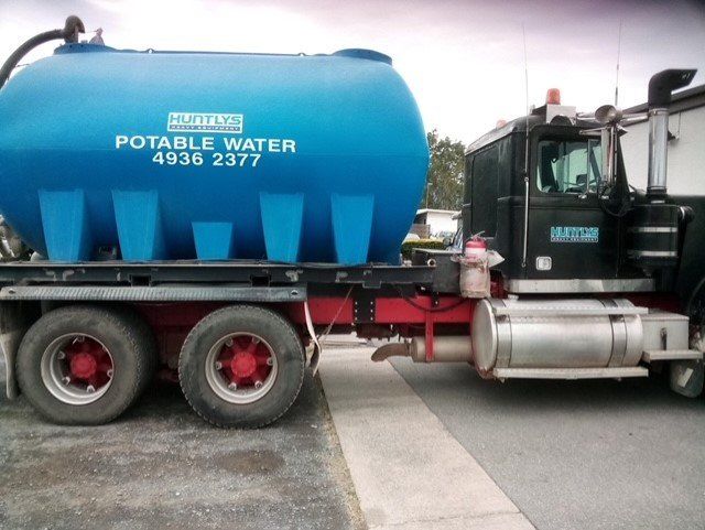 Water Truck Dust Control — Huntlys Heavy Equipment in Gracemere, QLD