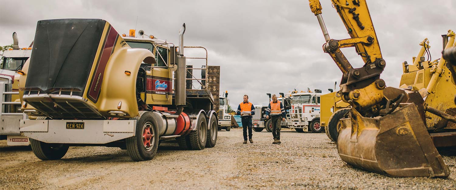 Red & White Semi Trucks — Huntlys Heavy Equipment in Gracemere, QLD
