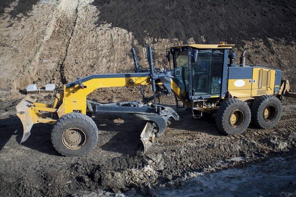 Grader on A Dirt Road