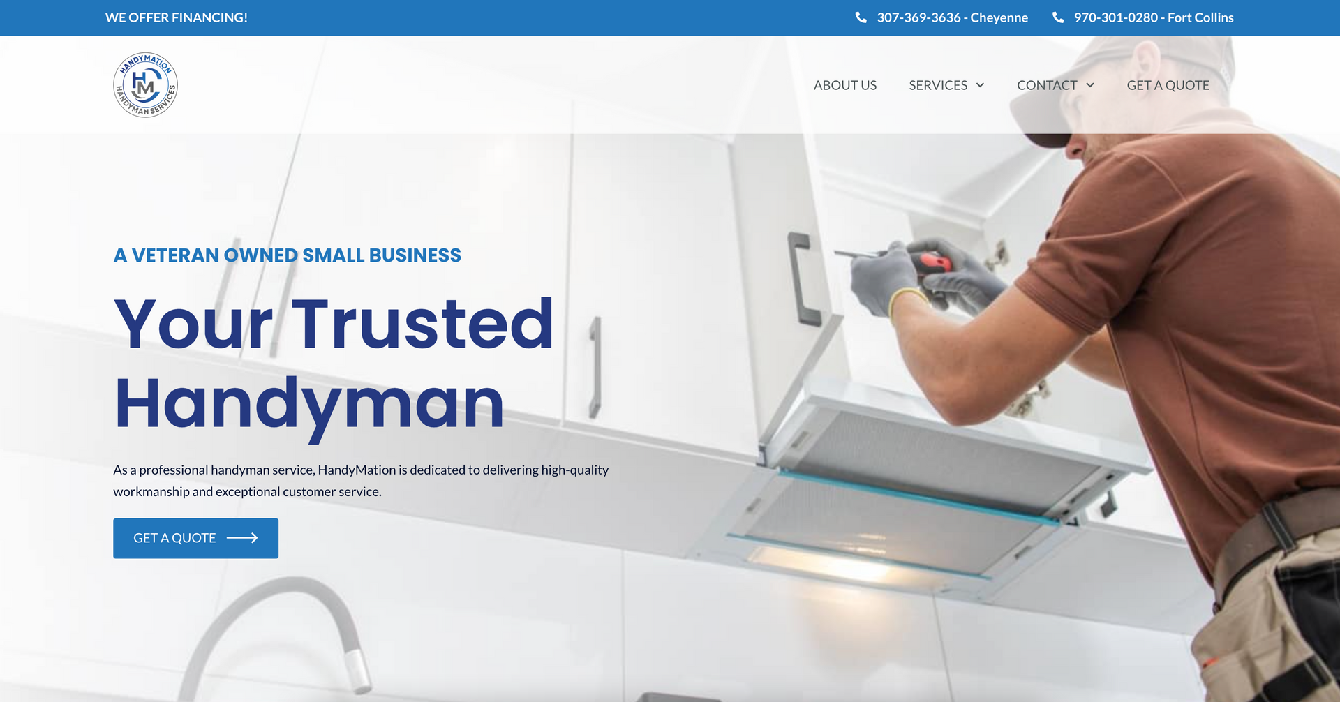 A man is working on a kitchen hood with a drill.