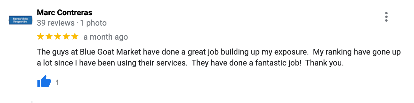 A blurred image of a google review with a thumbs up.