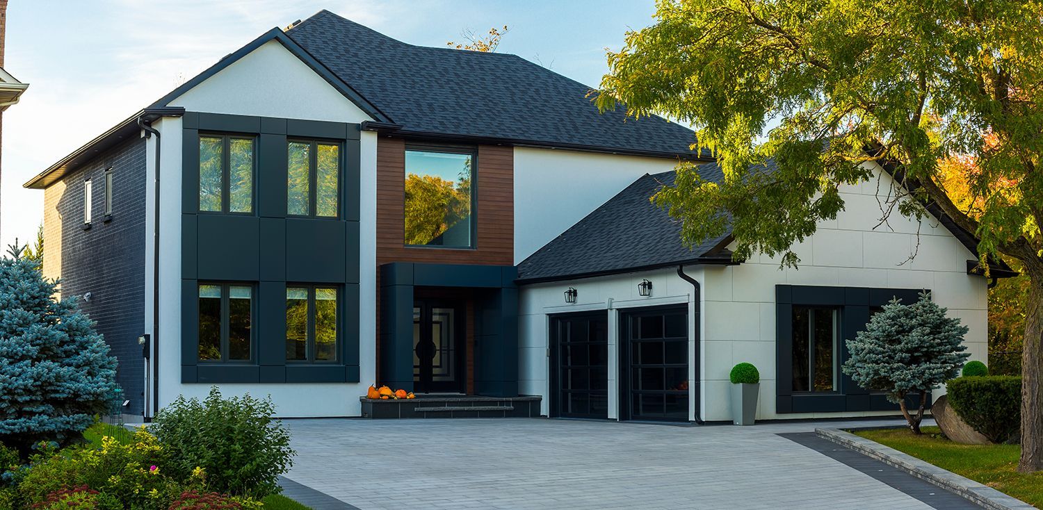 A custom-built luxury house in the suburbs, showcasing custom home building design. A custom-built luxury house in the suburbs, showcasing custom home building design.