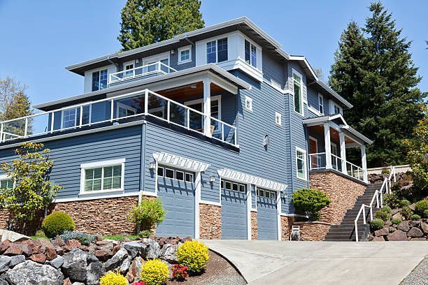View of a blue and white home exterior, showcasing residential building design.