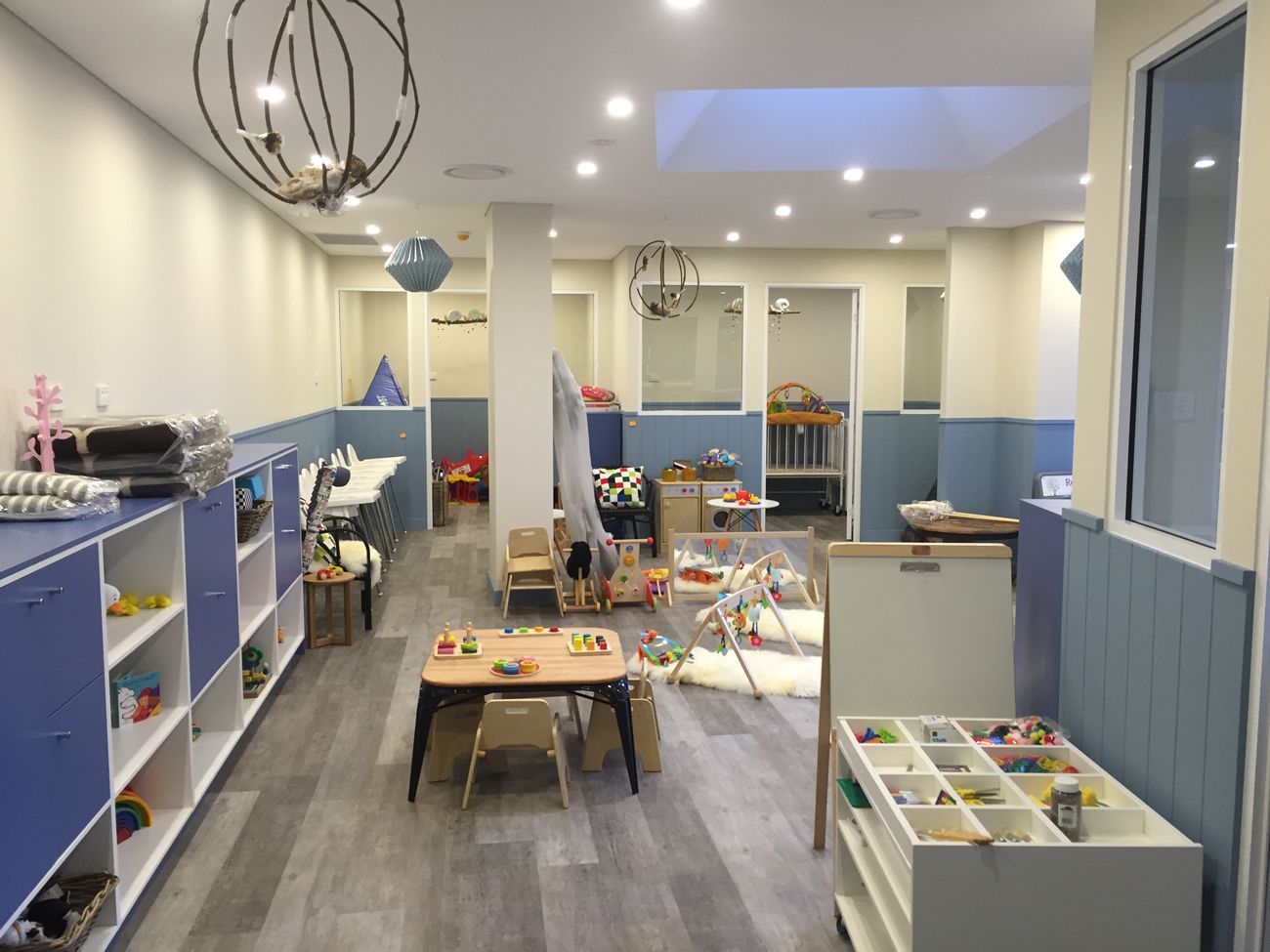 A room with a lot of toys and a table in it