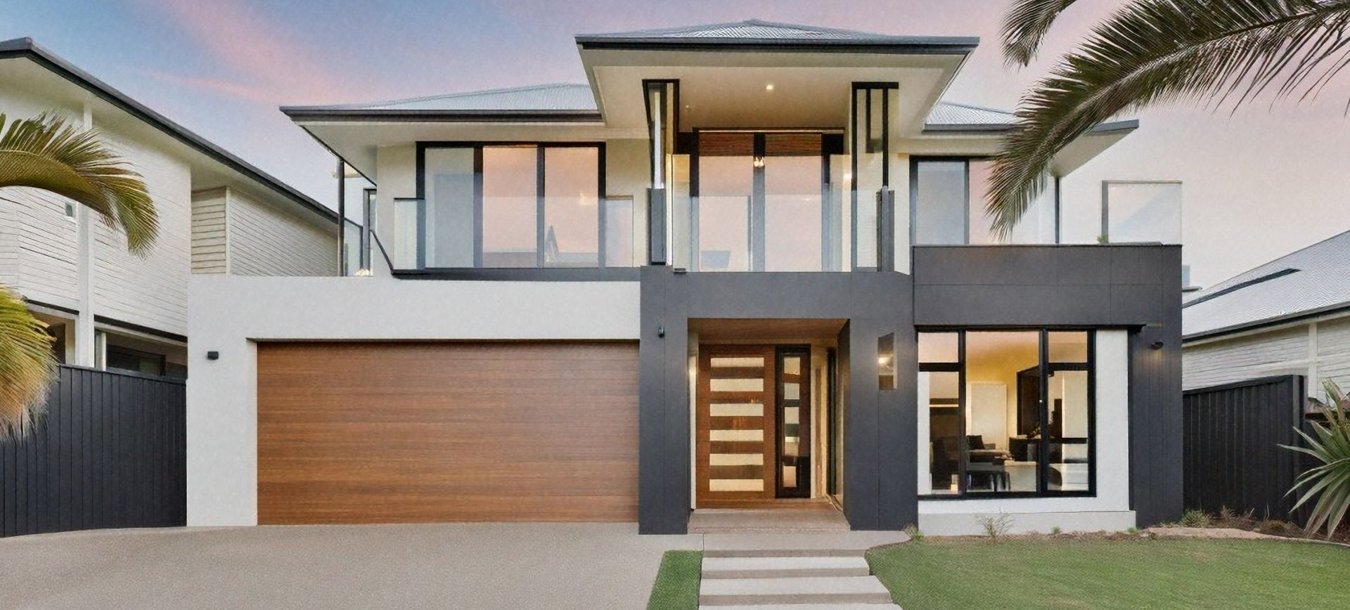 View of a blue and white home exterior, showcasing residential building design.