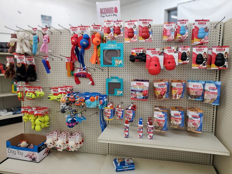a display of kong toys and treats in a store