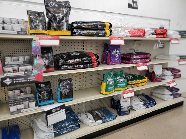 shelves filled with bags of grain free dog food