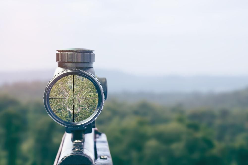 A Rifle Scope Positioned on a Hill — Coffs Coast Firearms In Coffs Harbour, NSW
