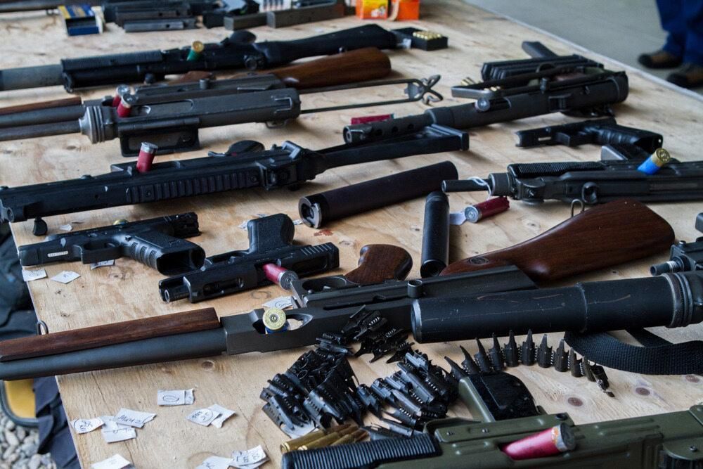 A Table Laden With Multiple Guns — Coffs Coast Firearms In Grafton, NSW