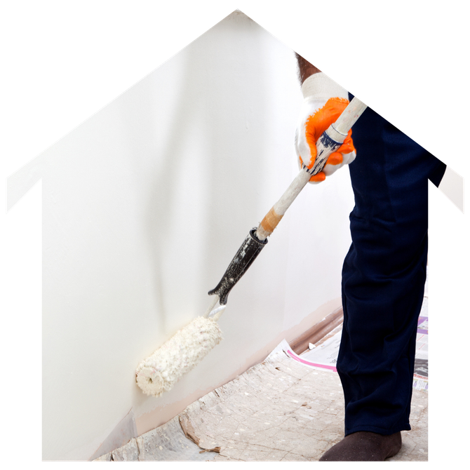 A person is painting a wall with a paint roller