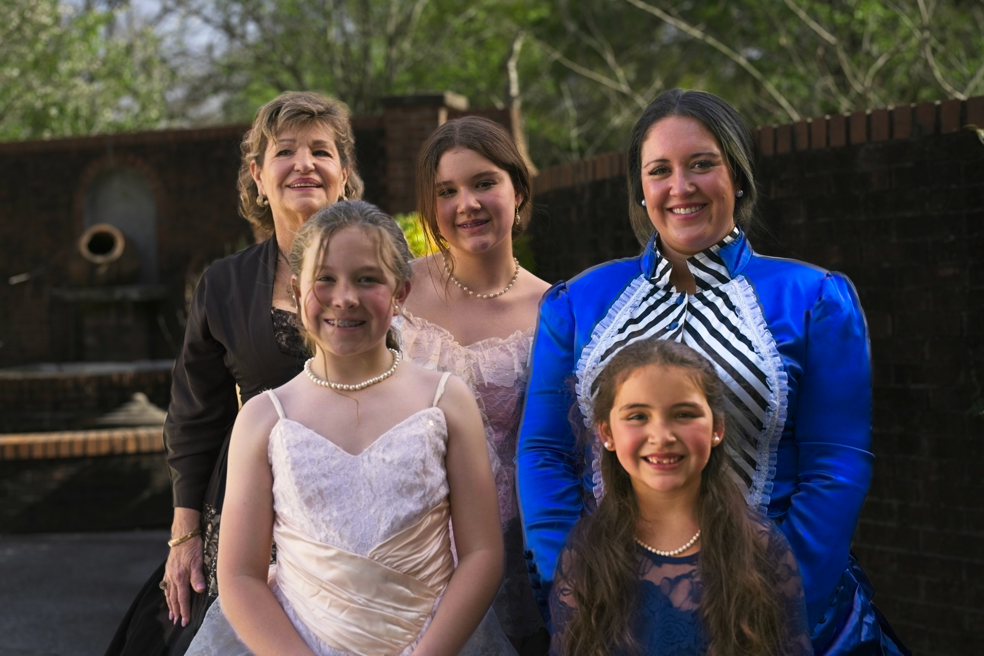 A group of women are posing for a picture together.