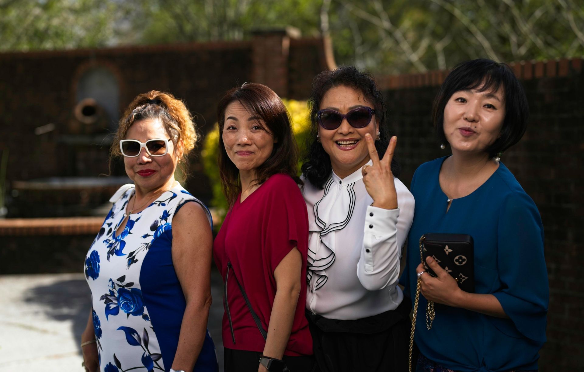 A group of women are posing for a picture together.