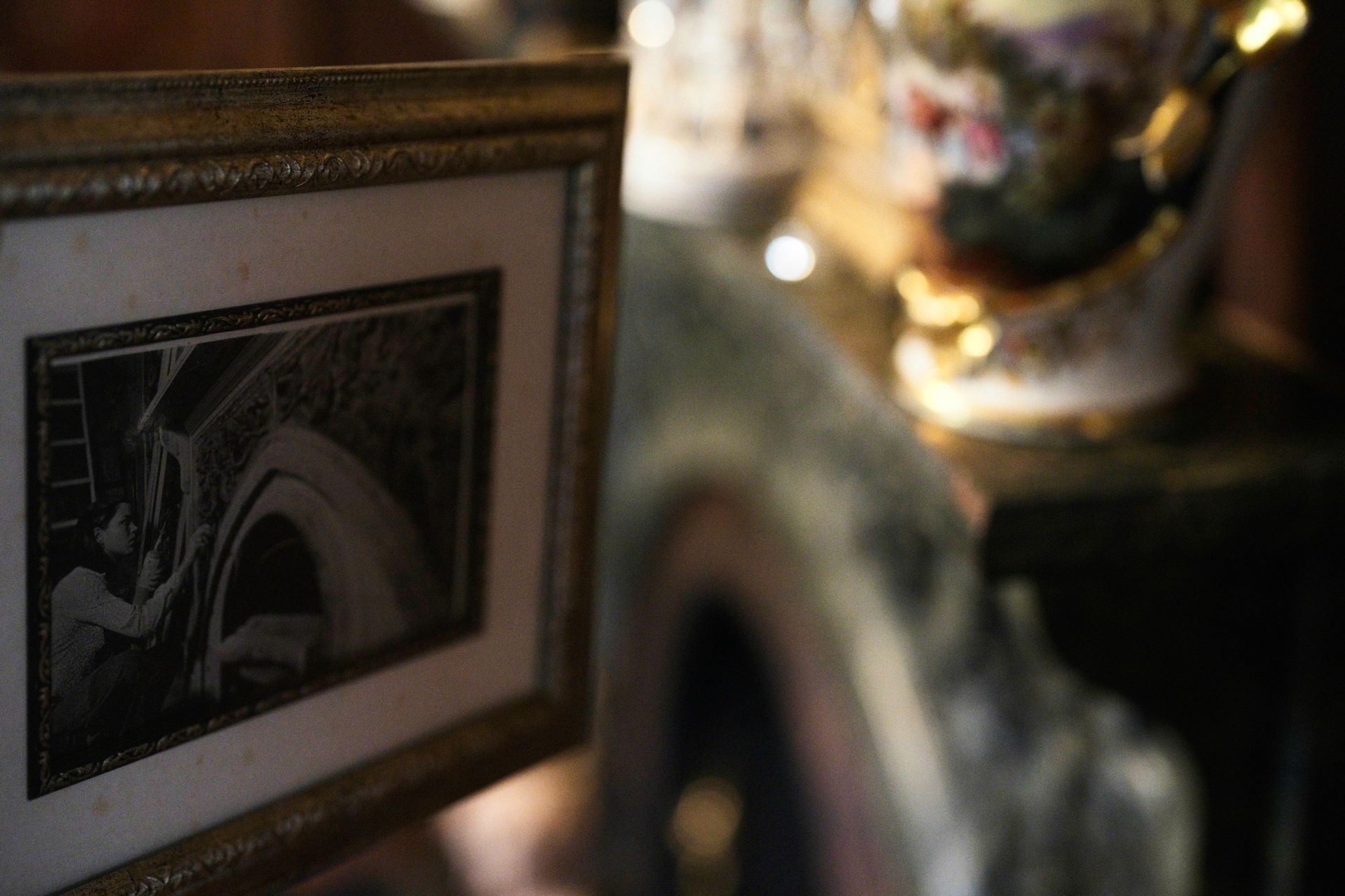 A framed picture of a woman is sitting on a table.