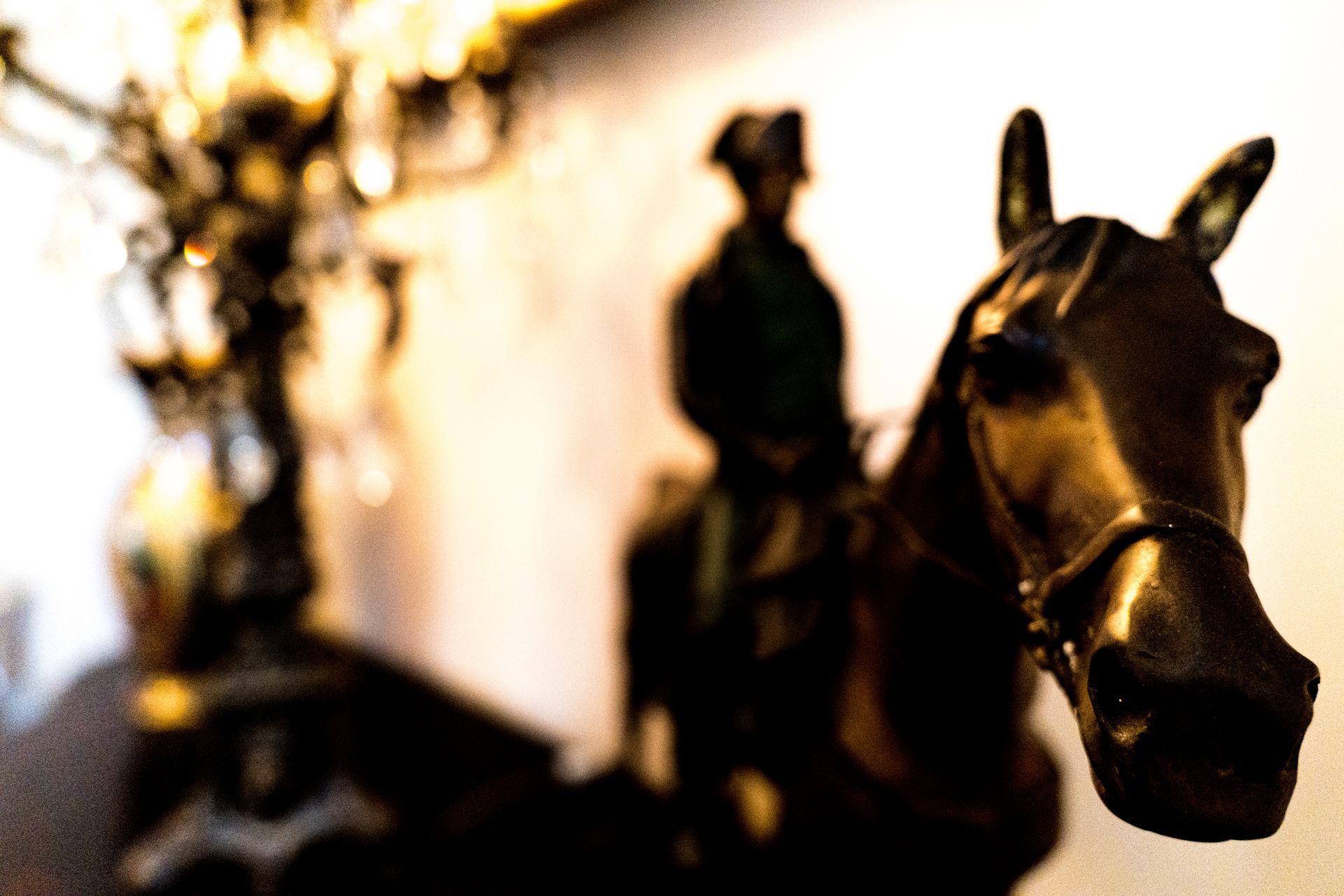 A statue of a man riding on the back of a horse