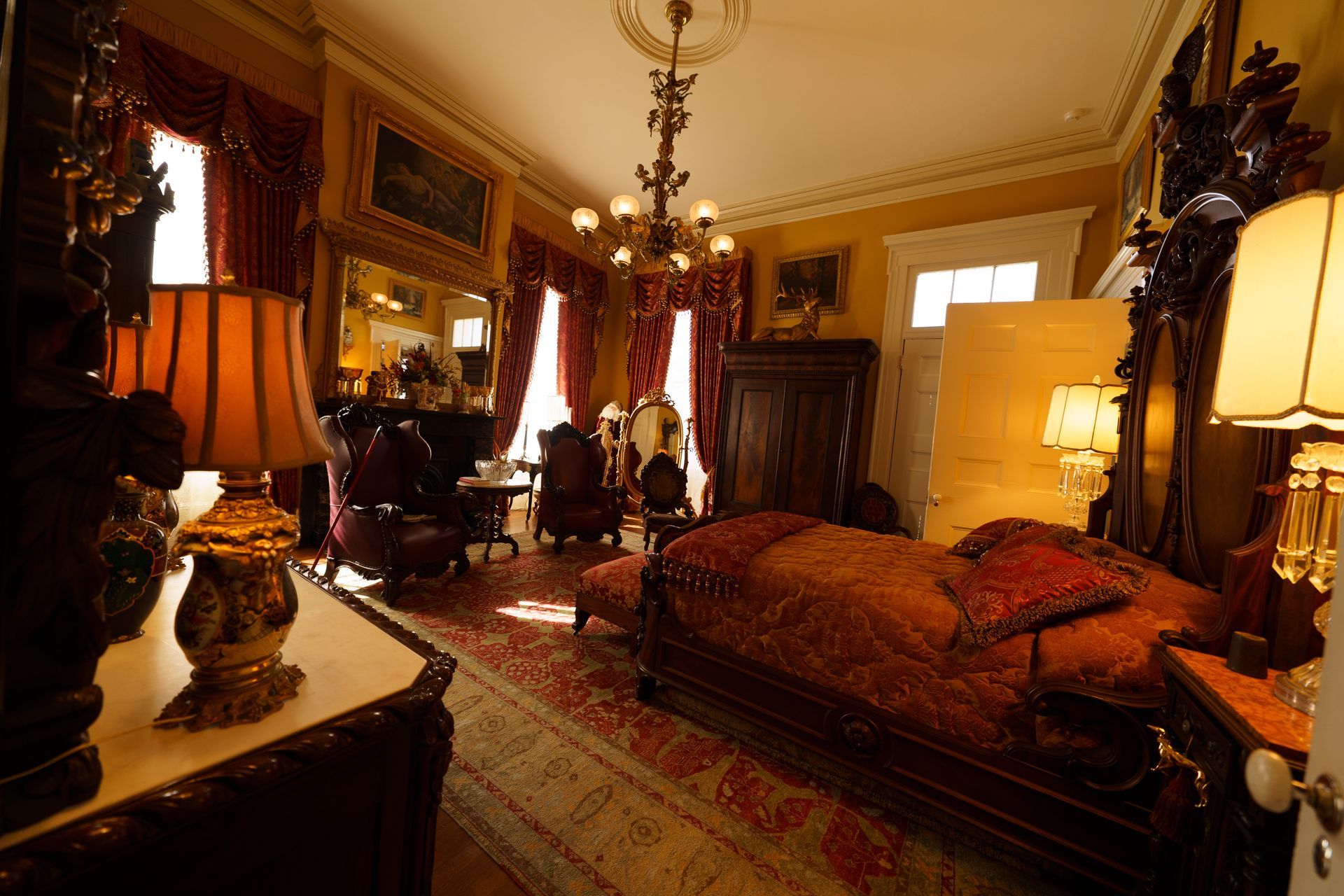 A bedroom with a large bed and lots of furniture