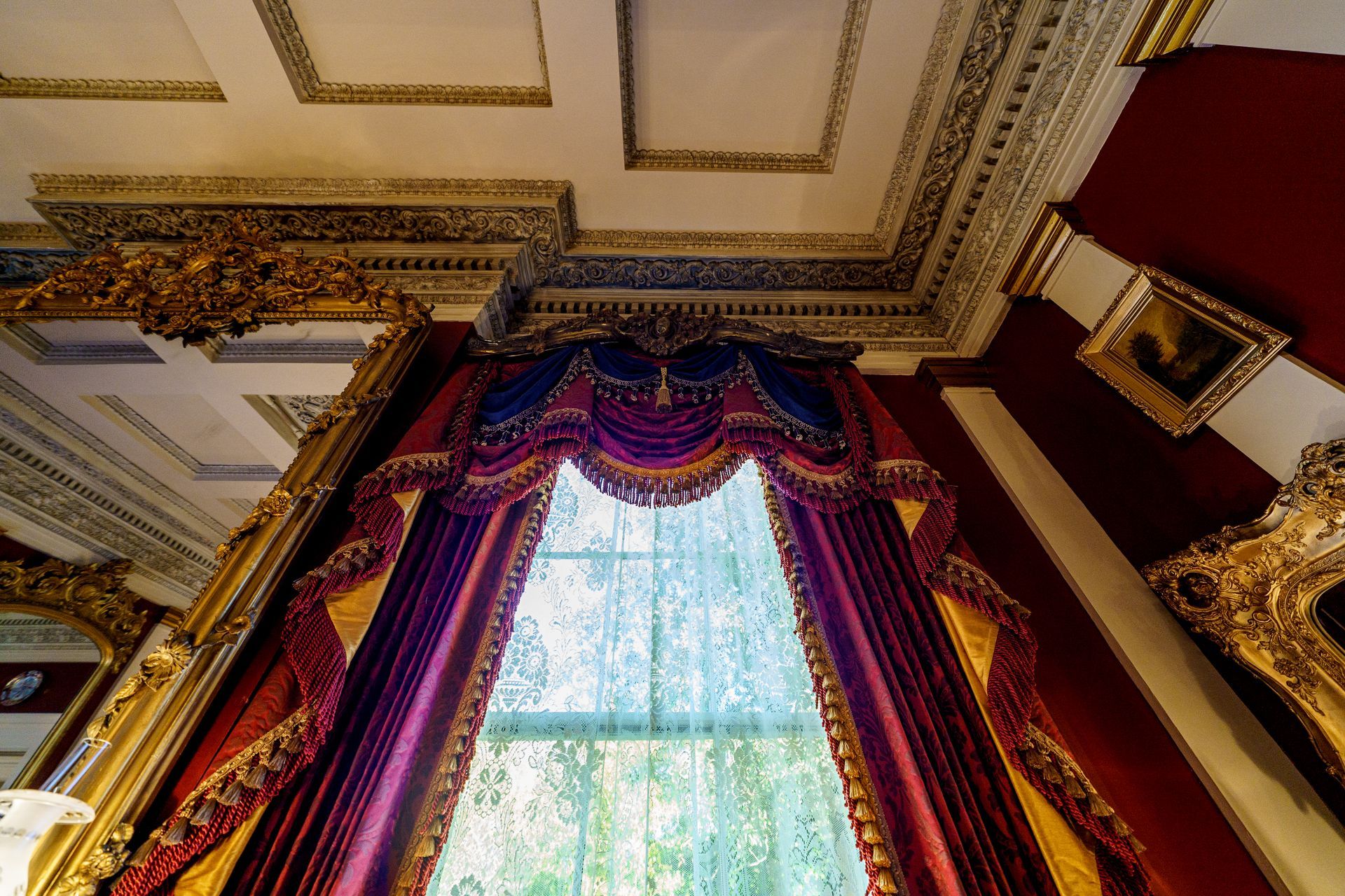 Looking up at a window with a purple curtain
