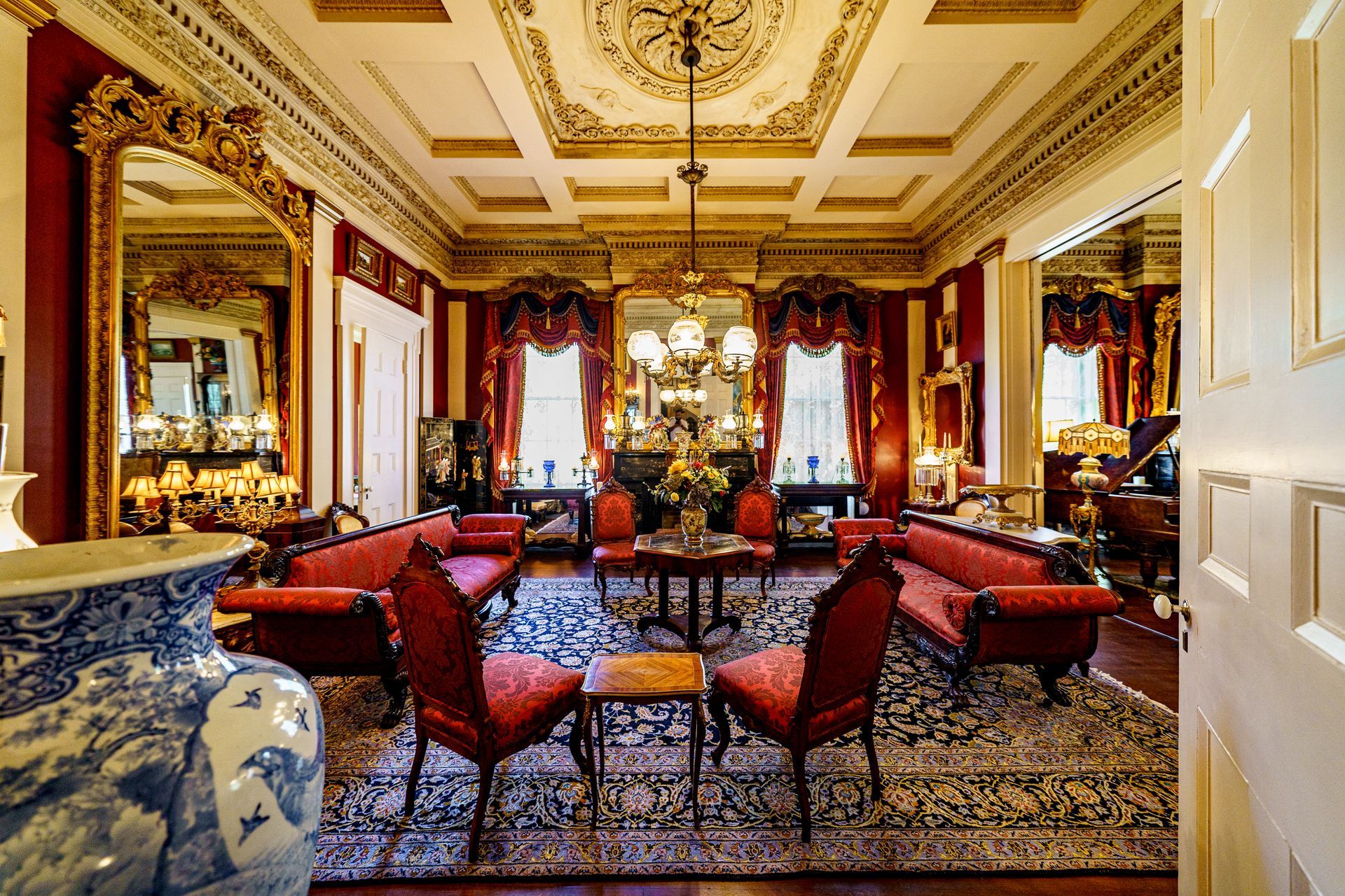 A living room filled with furniture and a piano.