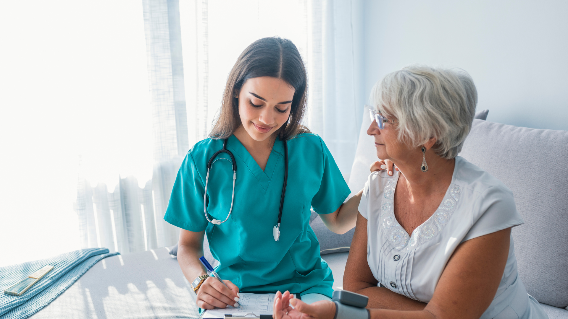 Quality Life Services Nurse with elderly female patient at Grove City Nursing Home