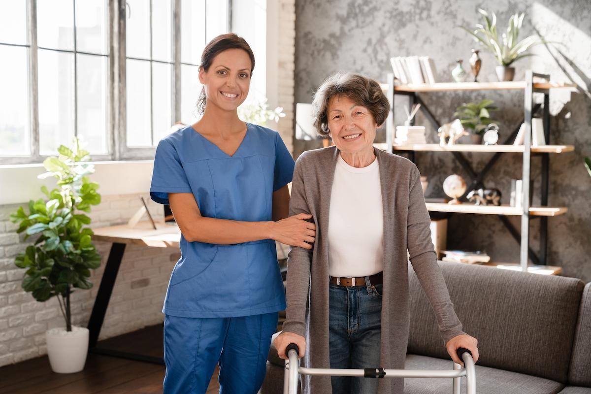 Portrait of happy smiling caretaker medicine worker nurse helping elderly senior patient with nurse.