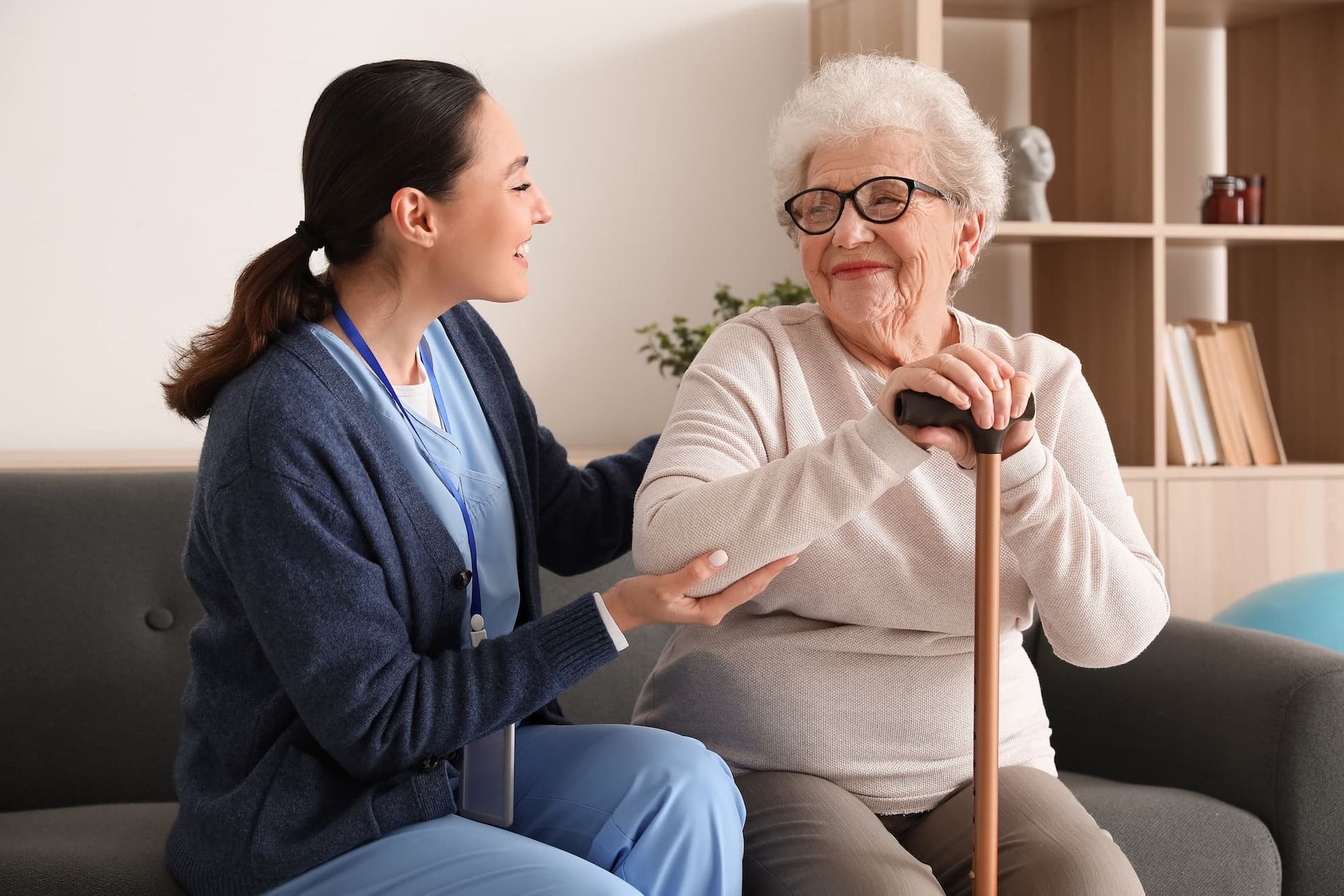 image of elderly woman smiling with a young female nurse