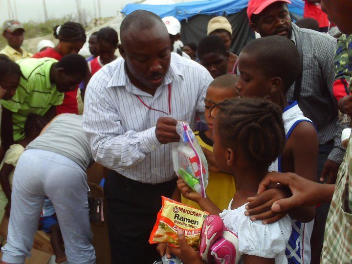 A man is holding a bag of mango chips