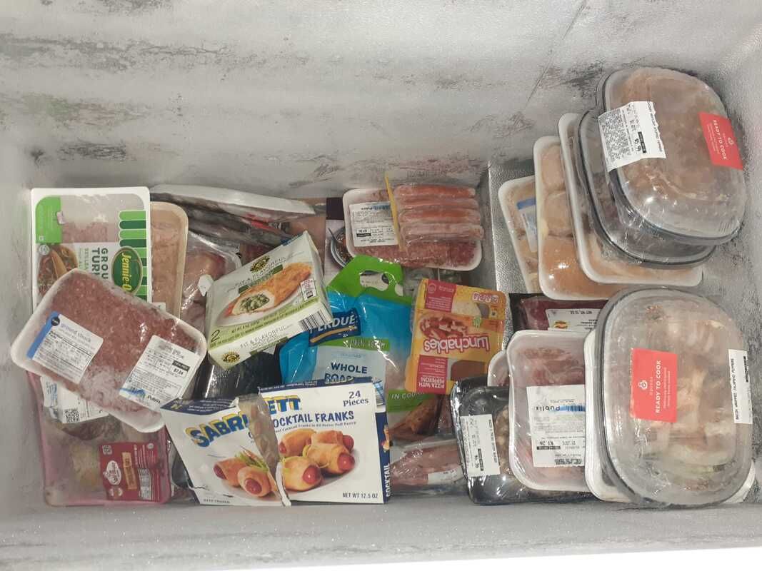 A freezer filled with a variety of frozen foods
