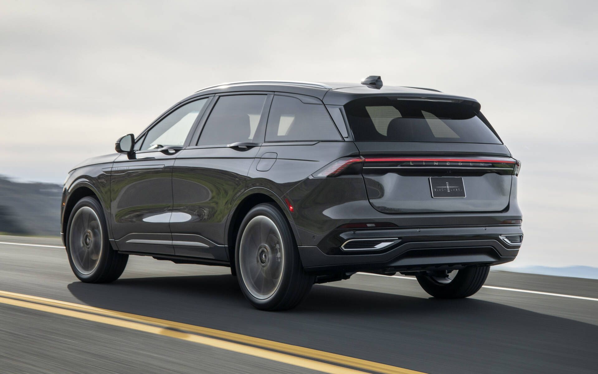 A black van is parked on a white background.