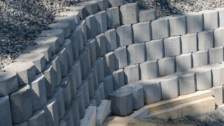 a retaining wall made of stone blocks