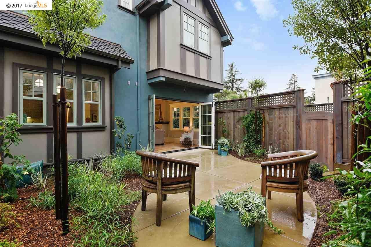 A house with a patio and chairs in front of it